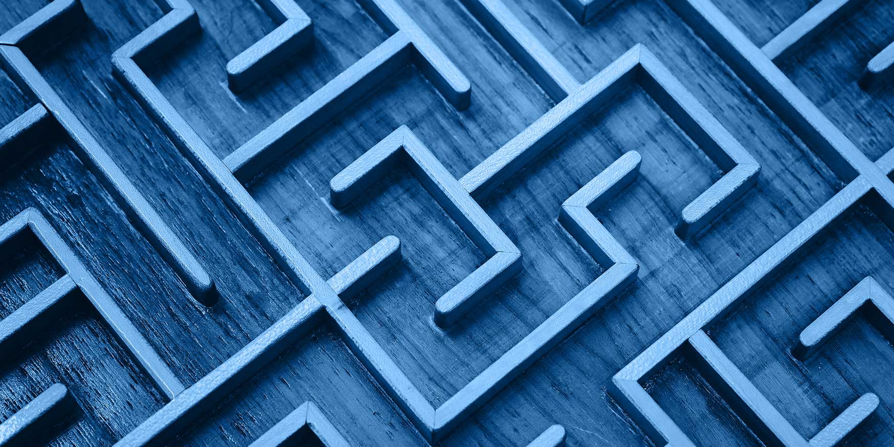 Blue wooden labyrinth maze puzzle close up