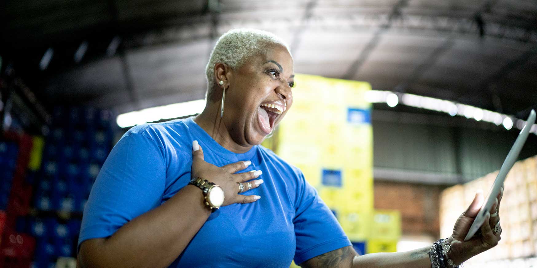 Warehouse worker surprised and ecstatic by recognition