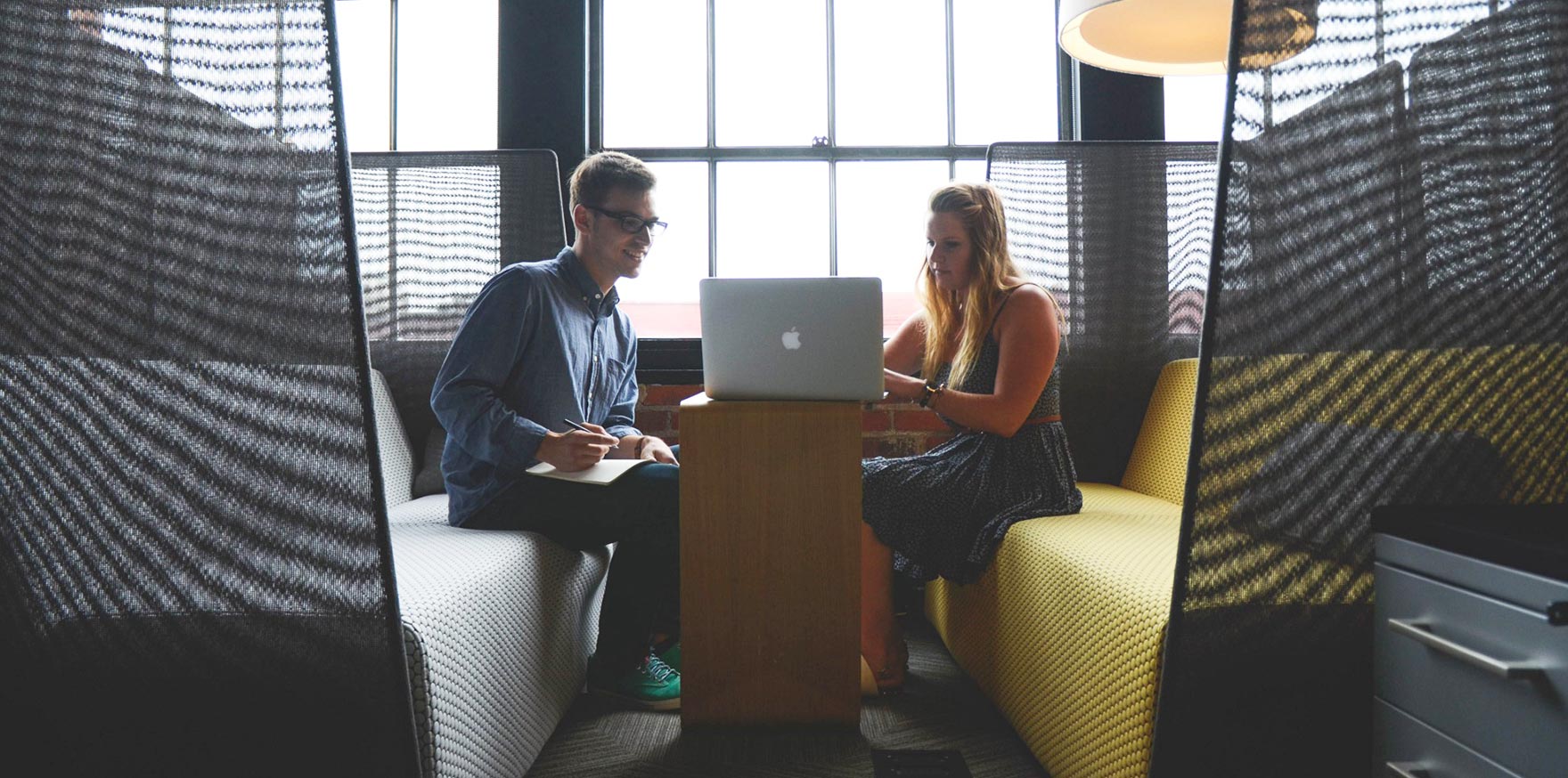 employees-working-together-on-a-computer