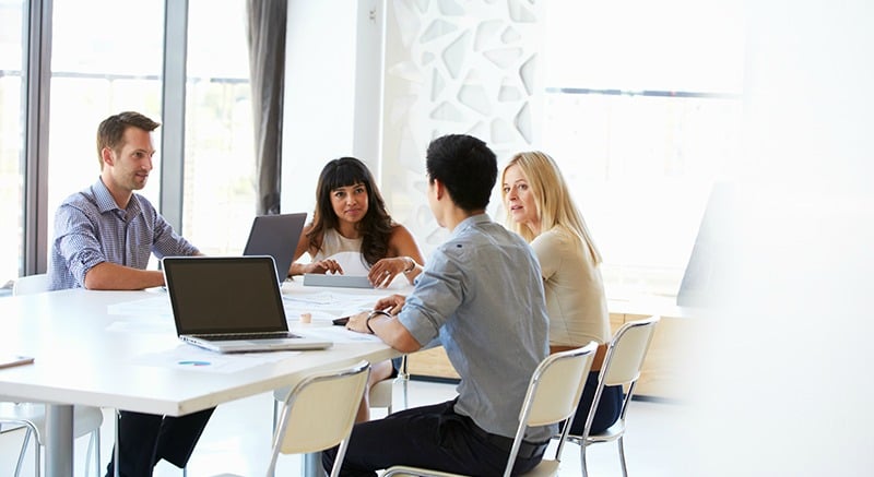 team-sitting-down-to-discuss-collaboration